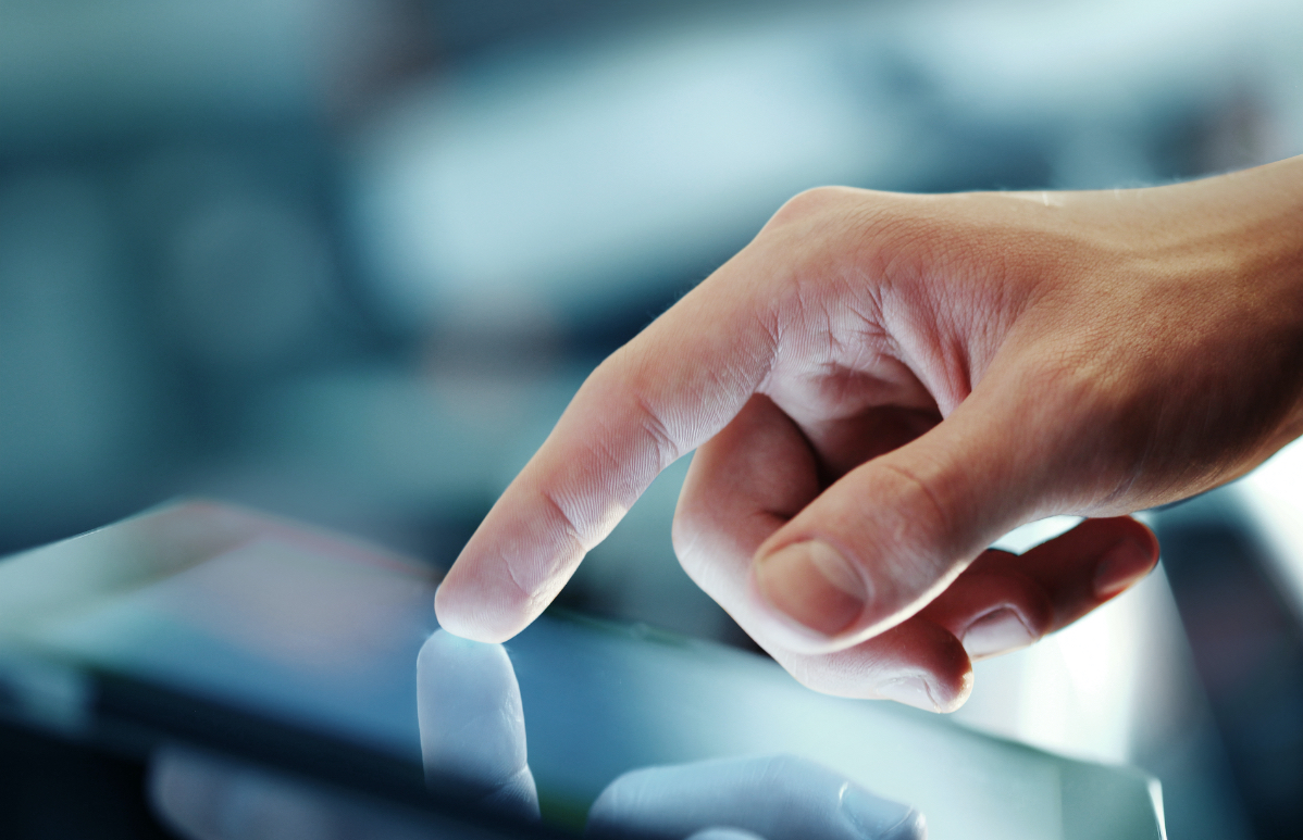 Image of a finger on a table screen