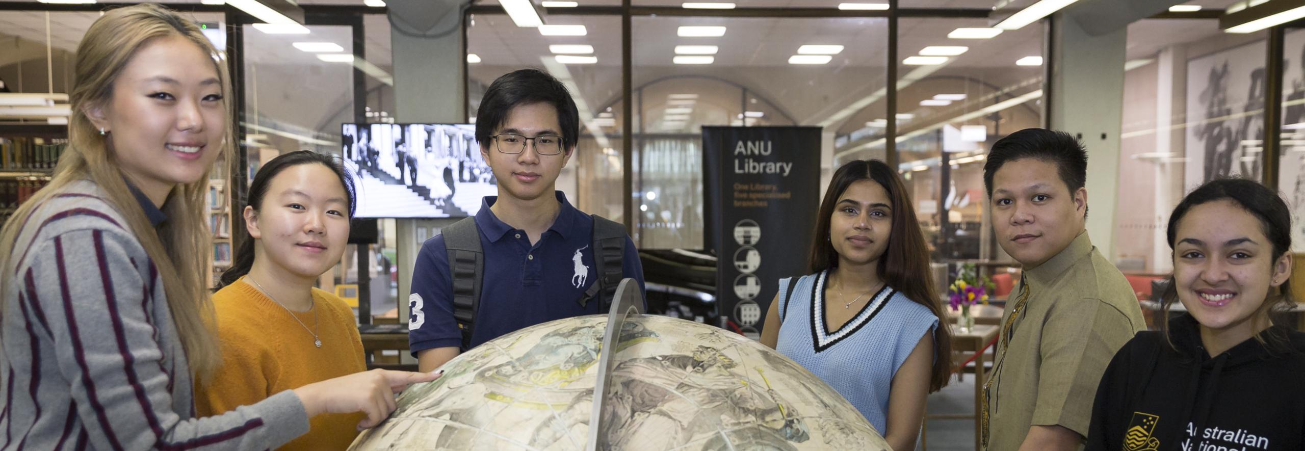 Students around a globe